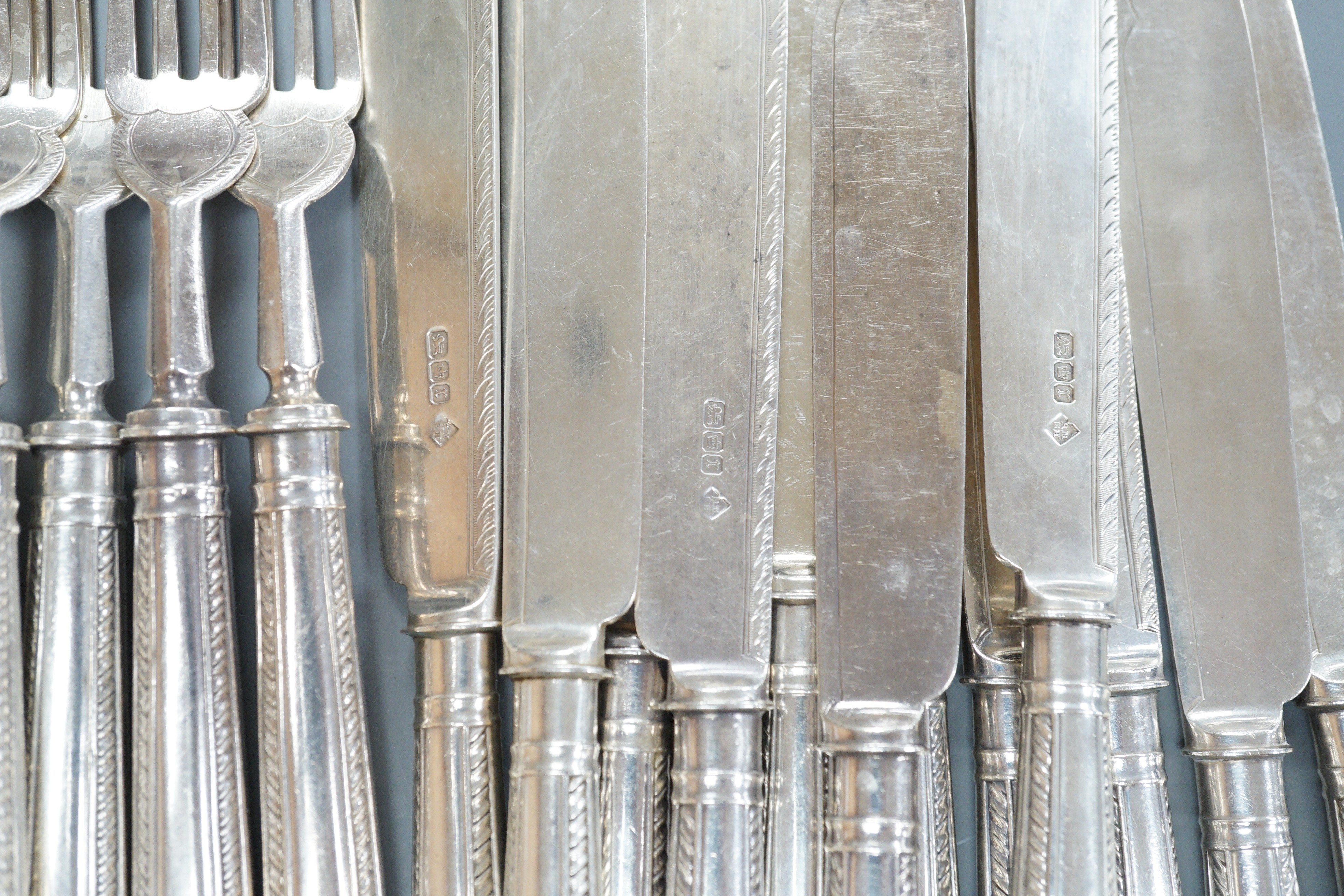 A set of twelve pairs of Edwardian silver fish eaters, Matin, Hall & Co, Sheffield, 1909, knife 21.2cm.